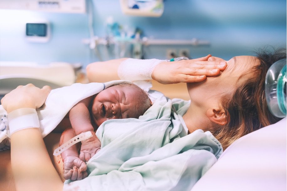 Mother holding newborn baby
