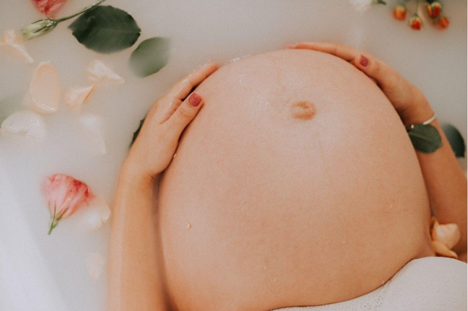 Pregnant woman in a bath